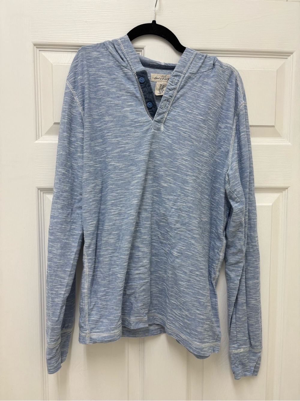 H&M L.O.G.G. light blue marled henley hoodie features a button-up neckline.